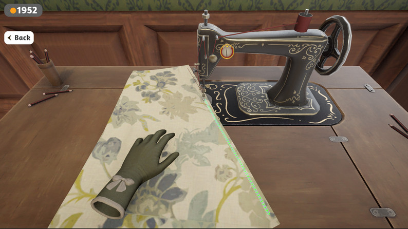 Dressmaker game sewing machine with floral fabric positioned for stitching